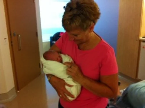 Grace Fox with newborn grandchild